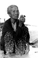 Burmese elder smoking on a cheerot